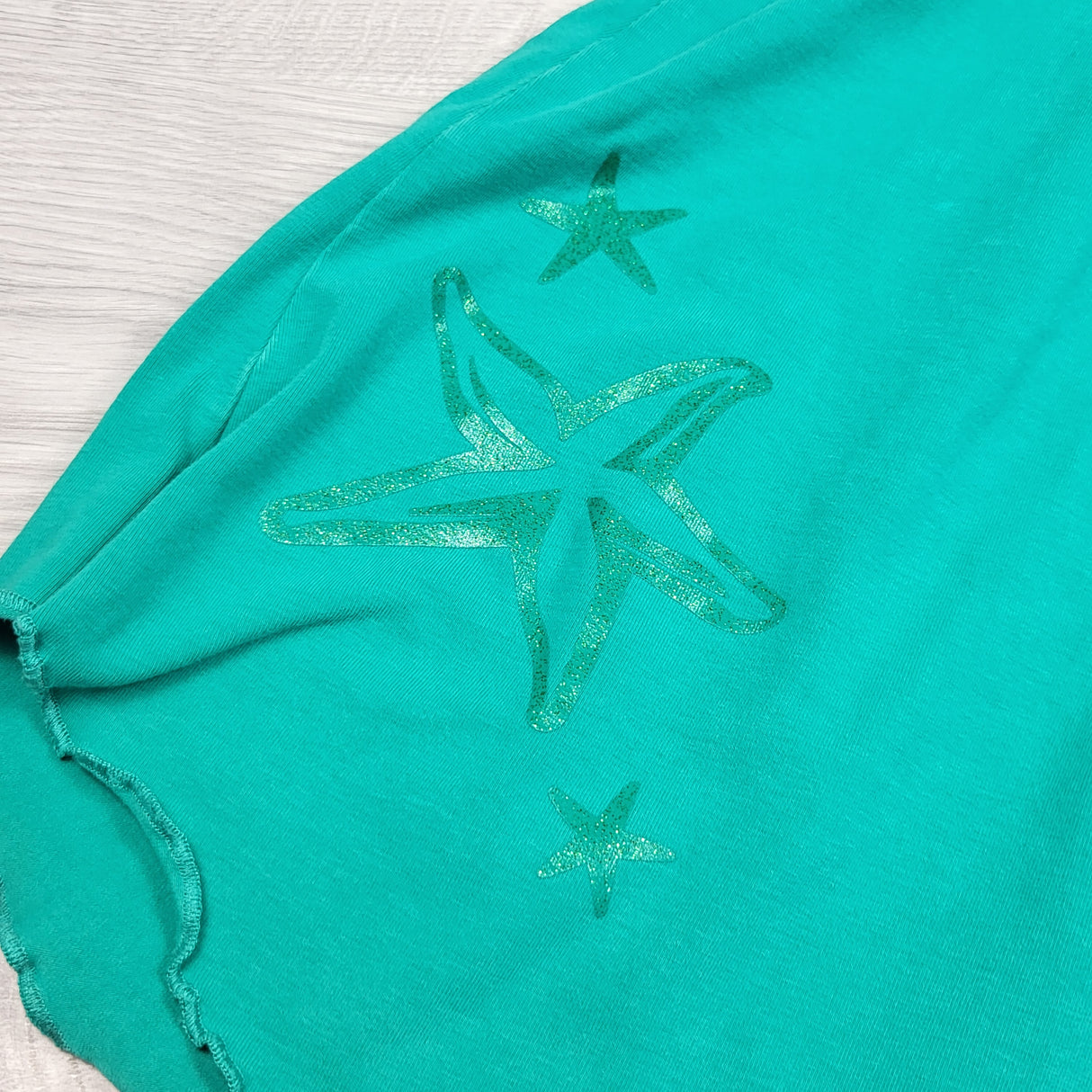 Peekaboo Beans green sleeveless dress with ruffle and sea stars. Size 7