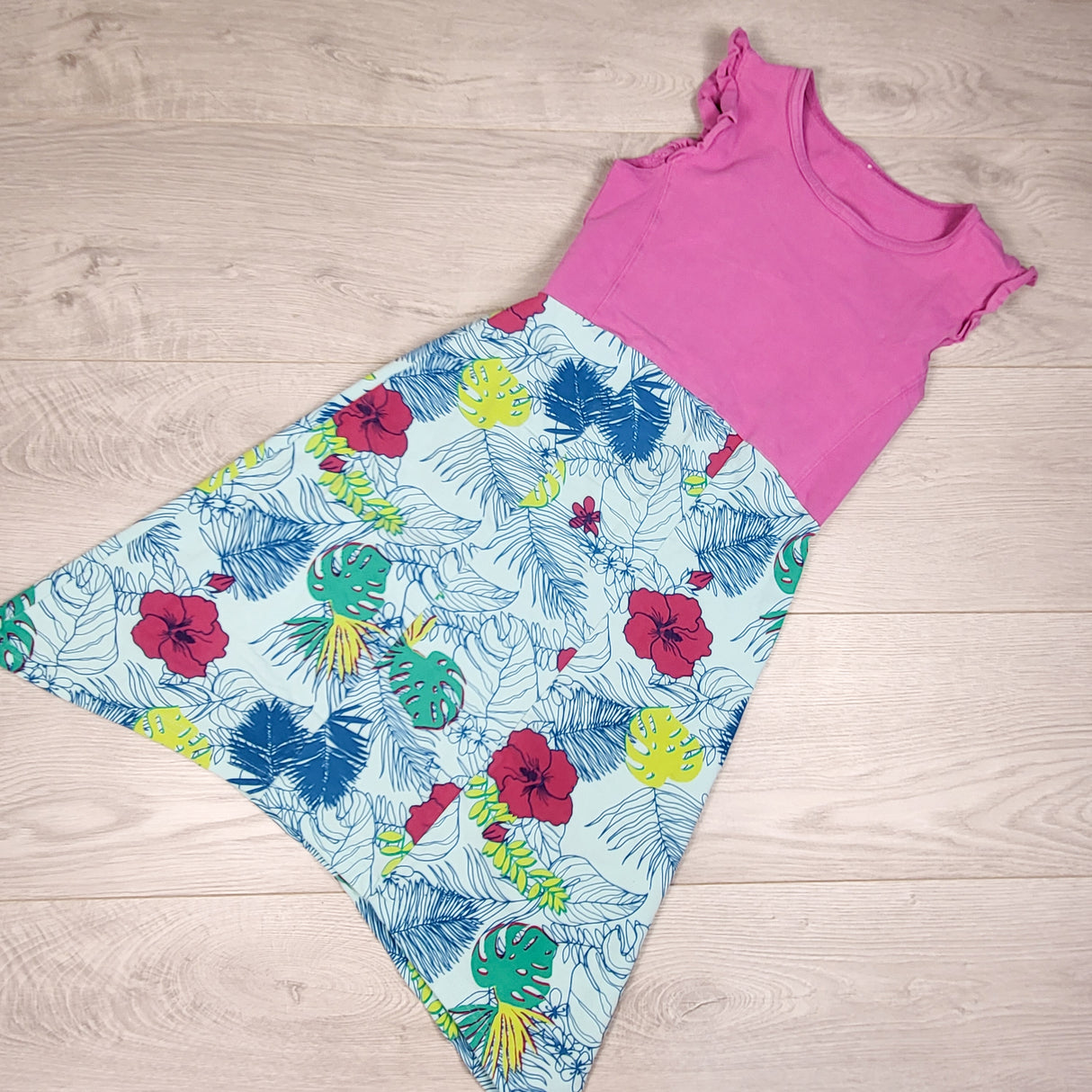 Peekaboo Beans pink dress with tropical print skirting. Size 7