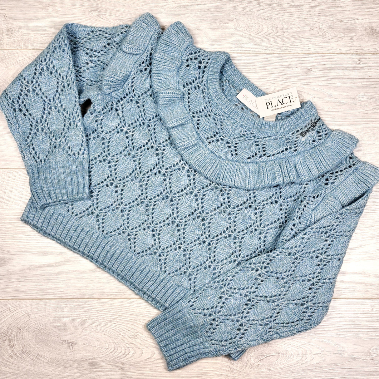NEW - Children's Place blue open knit sweater with ruffle. Size 5/6