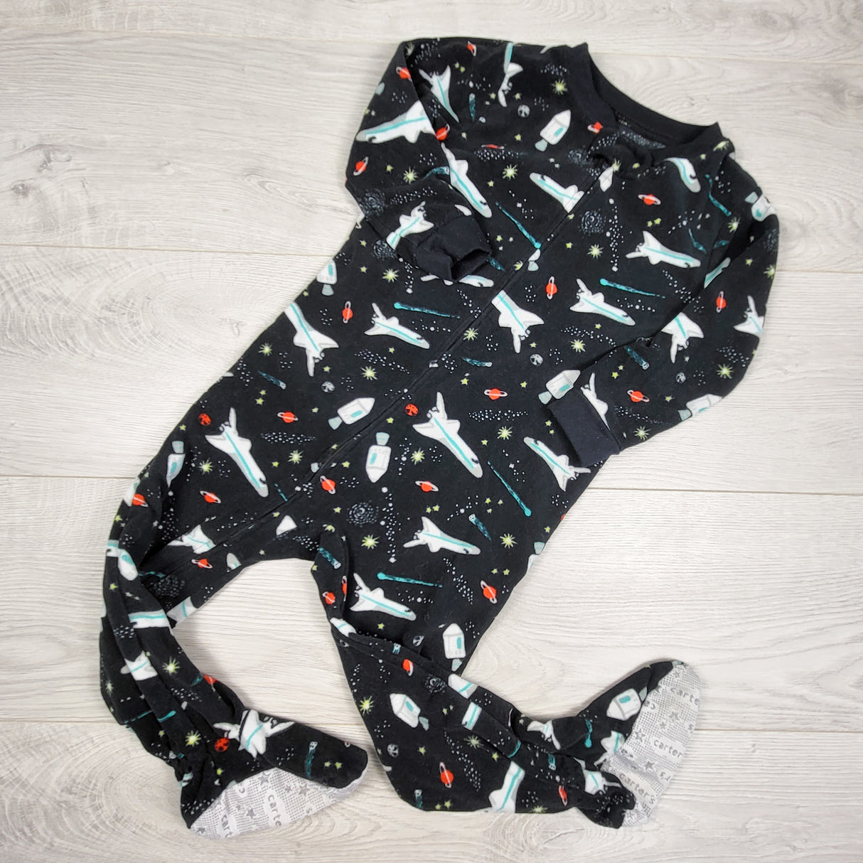 Carters black zippered fleece sleeper with rockets. Size 3T