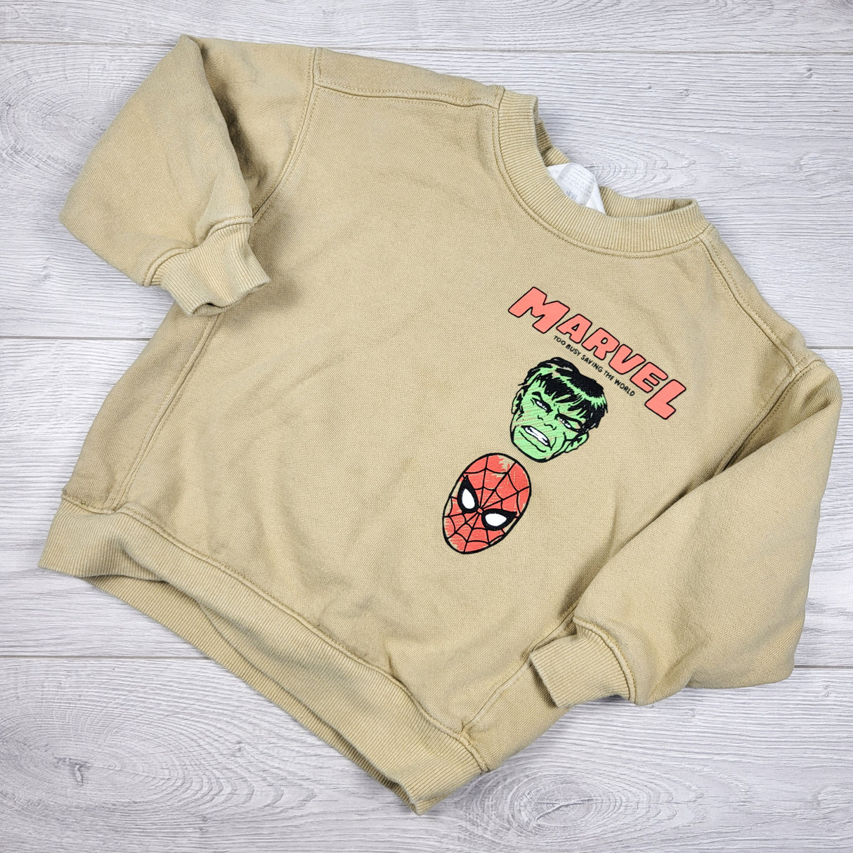 H and M beige Marvel sweatshirt. Size 2-4T