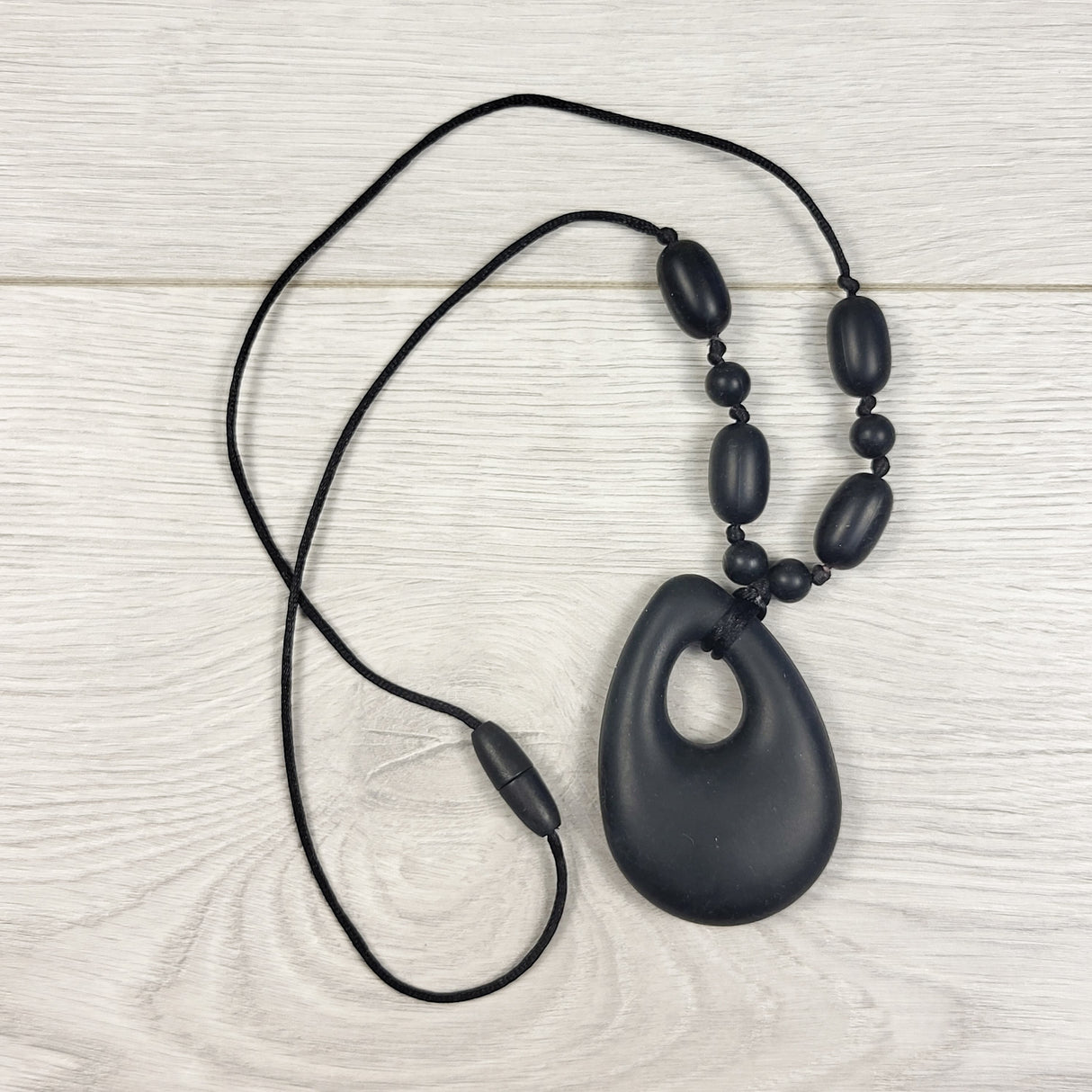 Black silicone teardrop pendant chewelry necklace with pop-away clasp