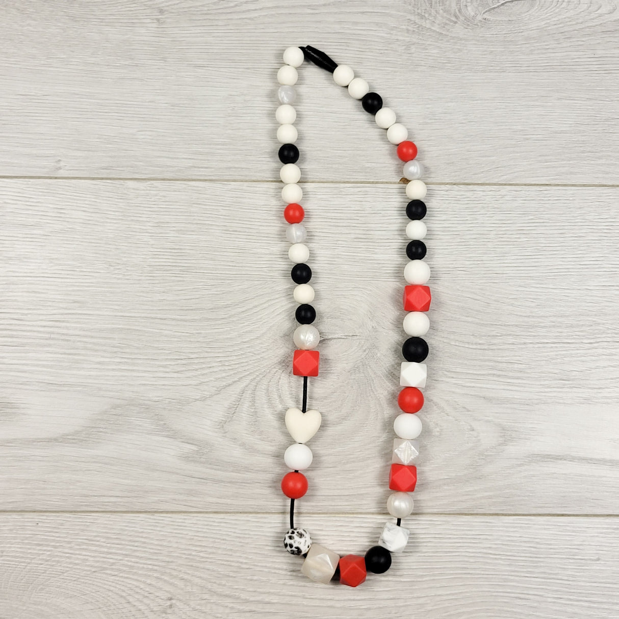 Black, white and red silicone chewlery necklace with pop-away clasp