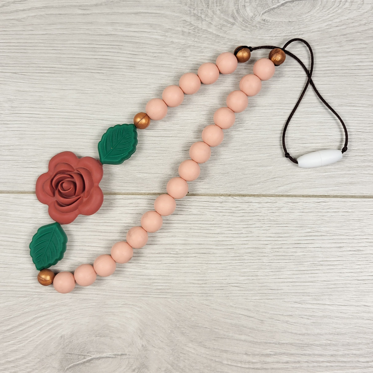 Pink silicone chewelry necklace with rose - has pop away clasp