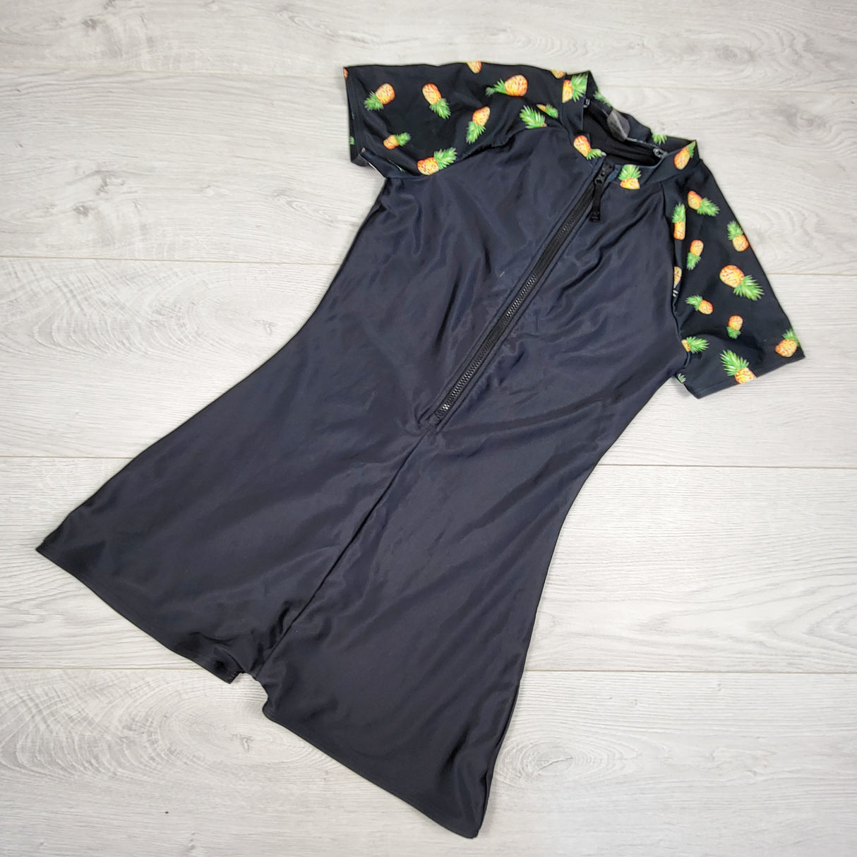 Old Navy one piece rash guard with pineapples. Size 14/16