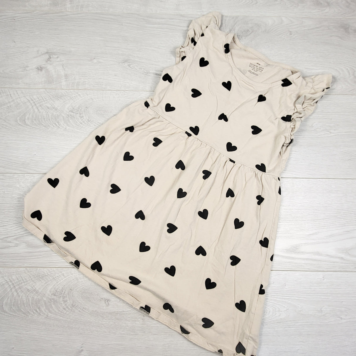 H and M beige dress with hearts. Size 8-10 Years - AS IS