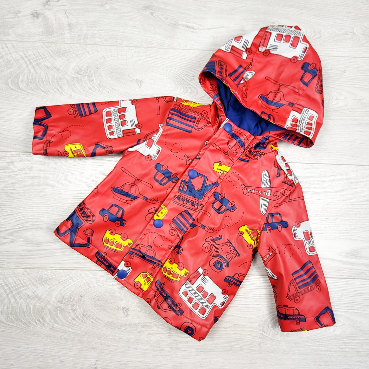 Joe red jersey lined rain coat with transportation theme. Size 3-6 months