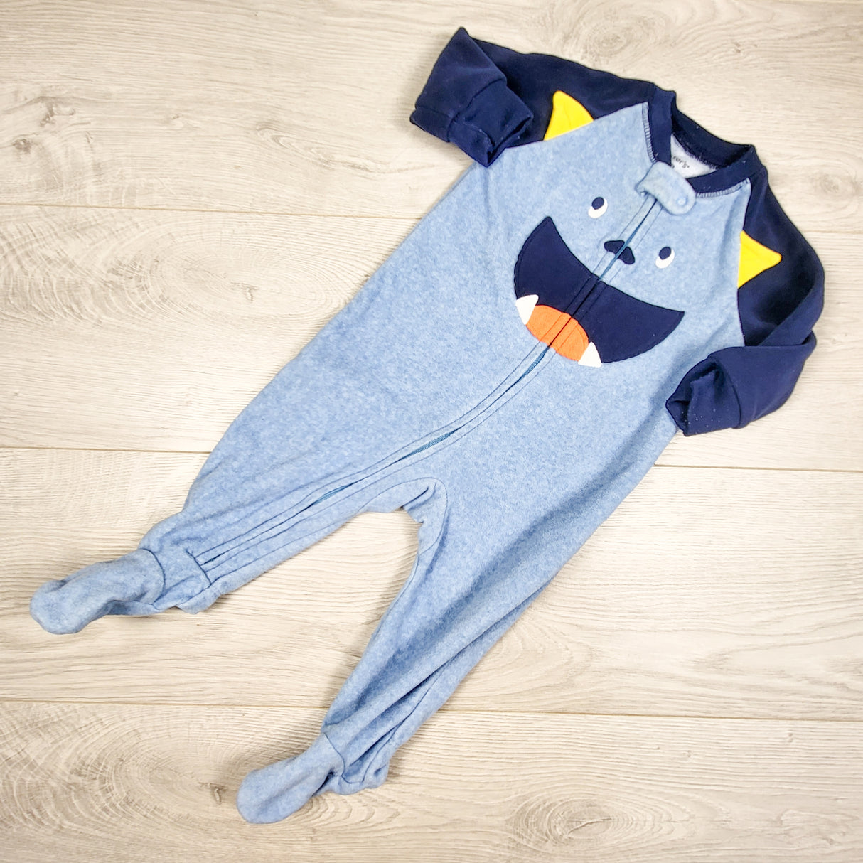 Carters blue and navy zippered fleece sleeper with monster. Size 6 months
