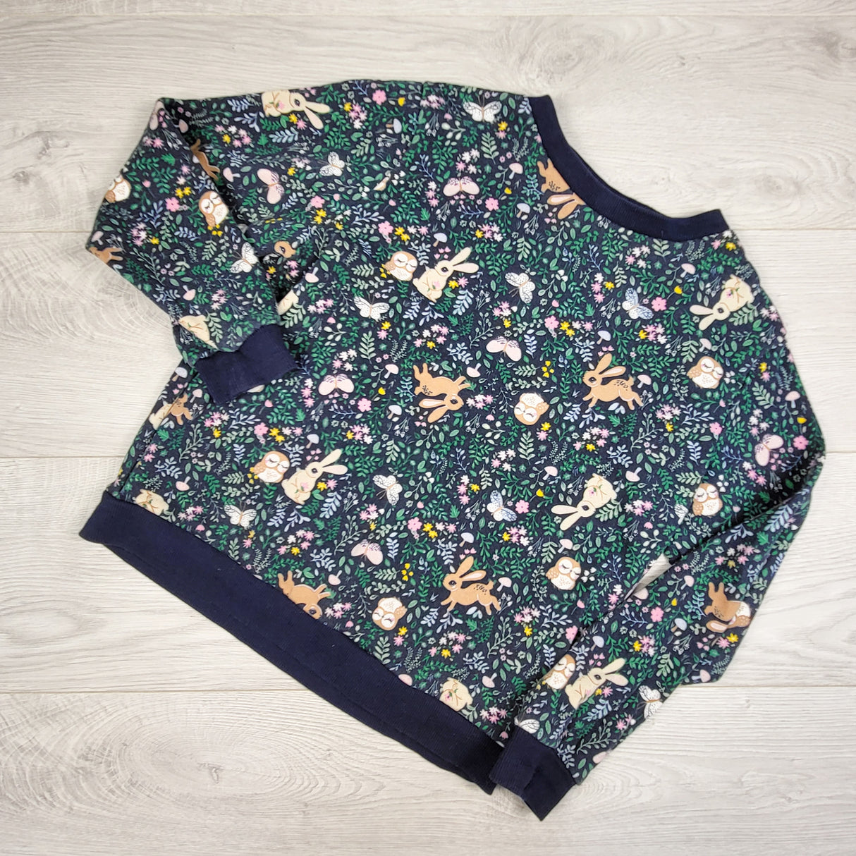 H and M navy floral print sweatshirt with woodland animals. Size 8-10 Years