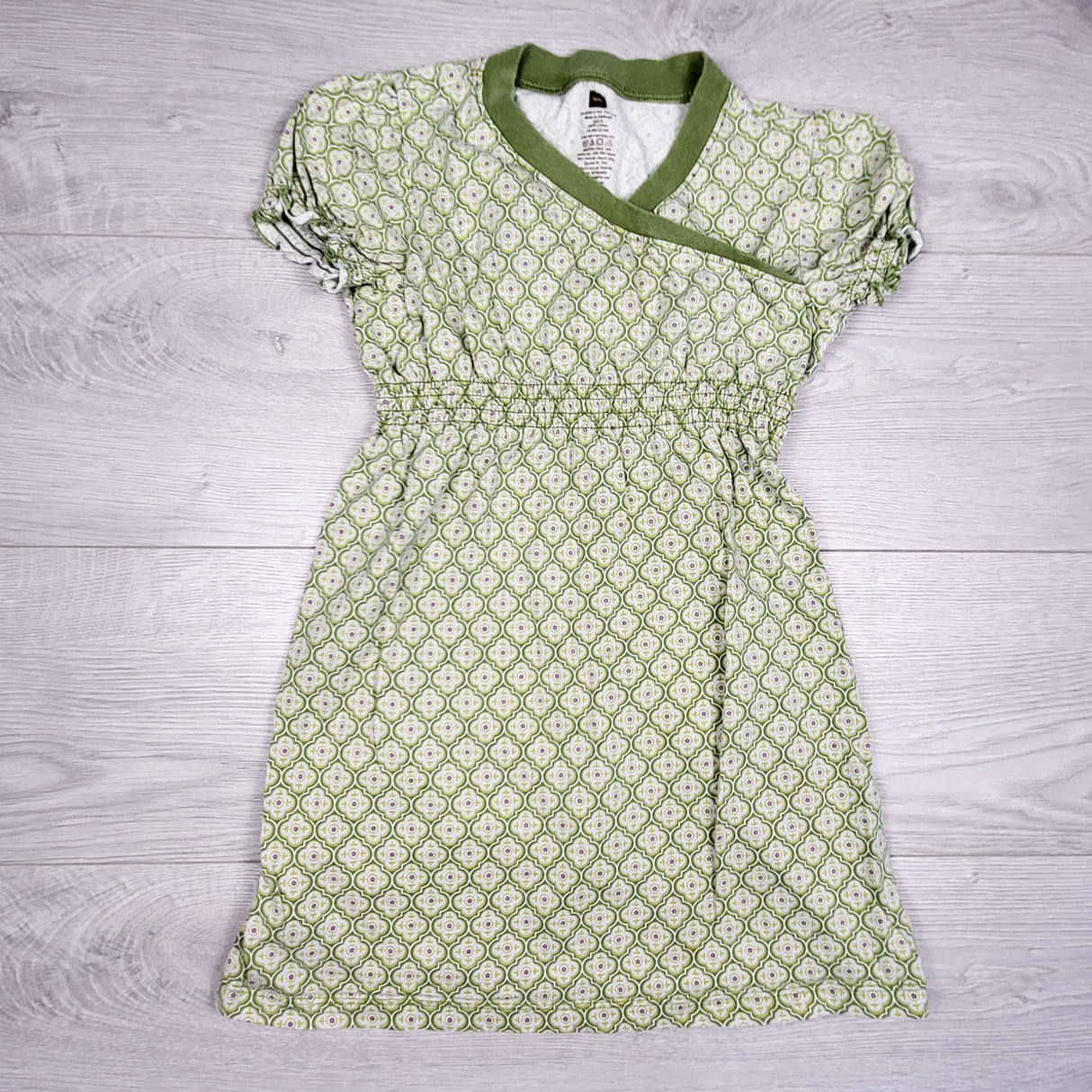 Tea Collection green patterned faux wrap dress. Size 6