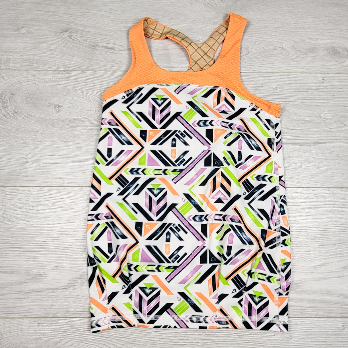 Ivivva (Lululemon) orange and white patterned active tank top. Size 6