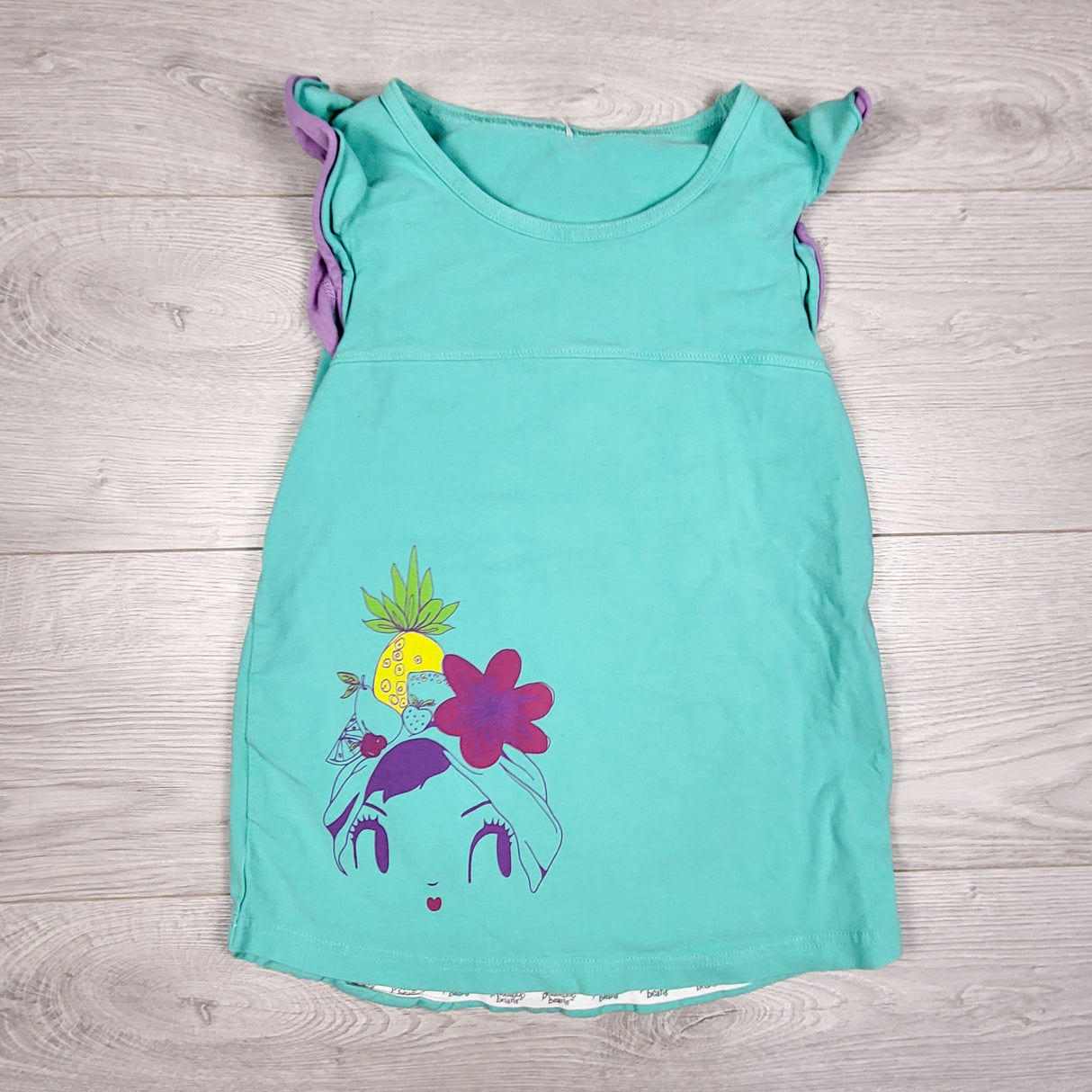 Peekaboo Beans turquoise top with woman. Size 7