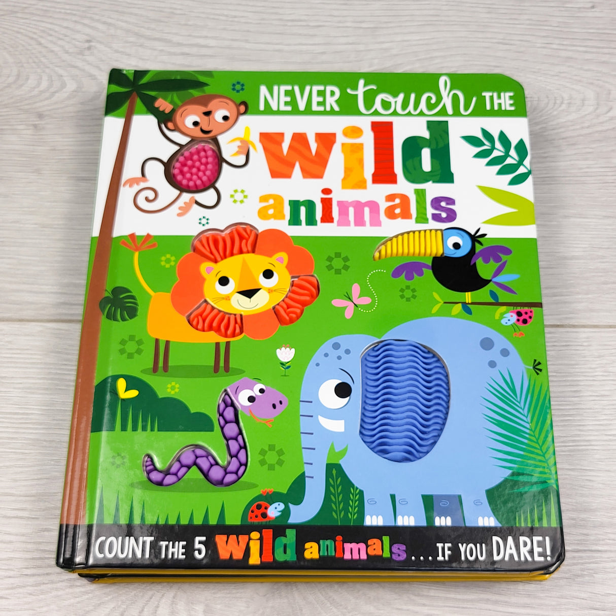 Never Touch the Wild Animals. Touch and feel board book