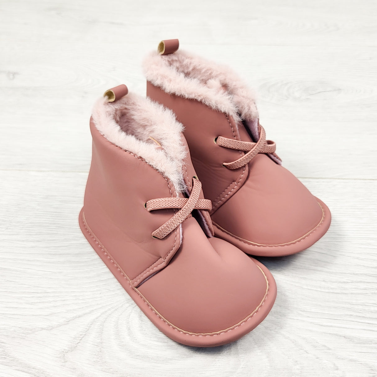 Carters pink soft soled booties. Size 9-12 months