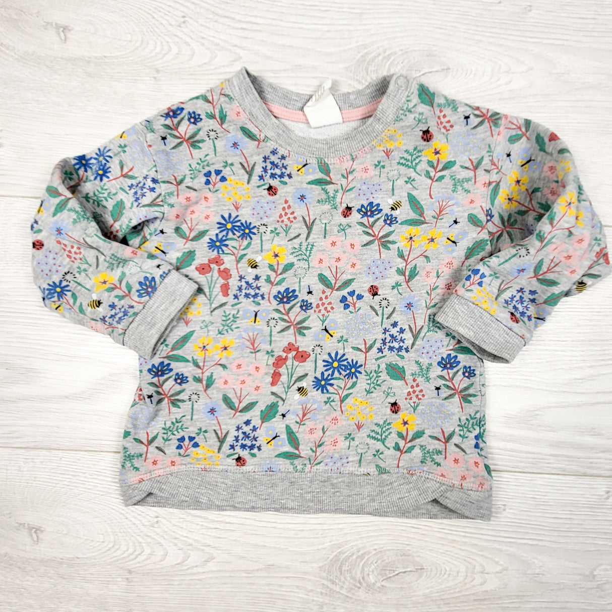 H and M grey floral print sweatshirt. Size 9-12 months