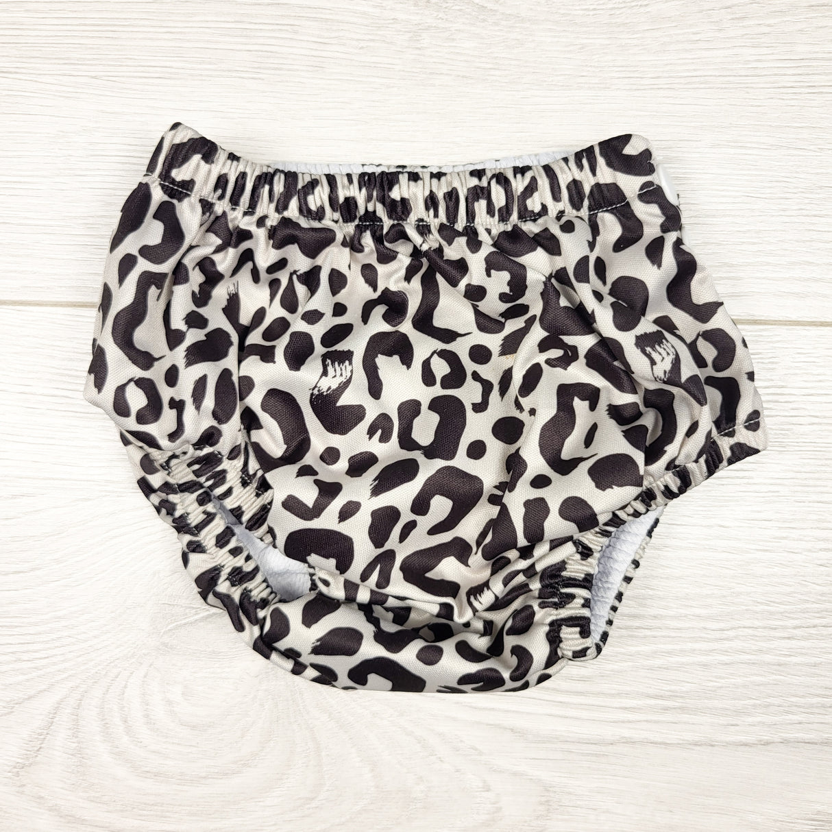 Honey Suckle Swim Co. leopard print reusable swim diaper. Size M (18-24 lbs)
