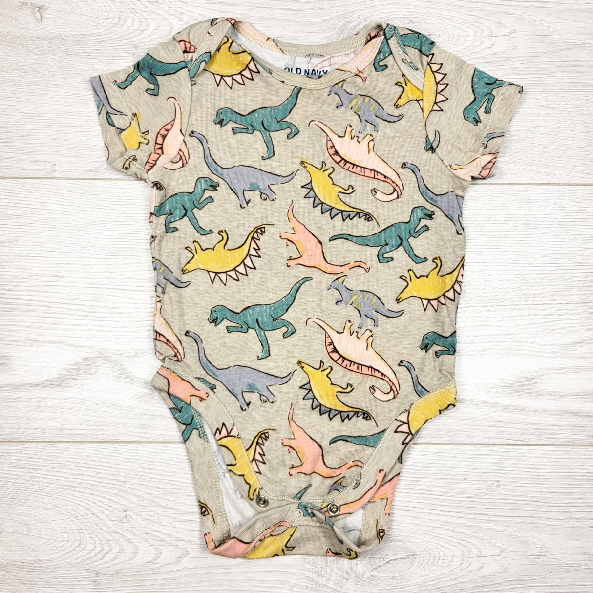 Old Nay beige dinosaur print bodysuit. Size 6-12 months