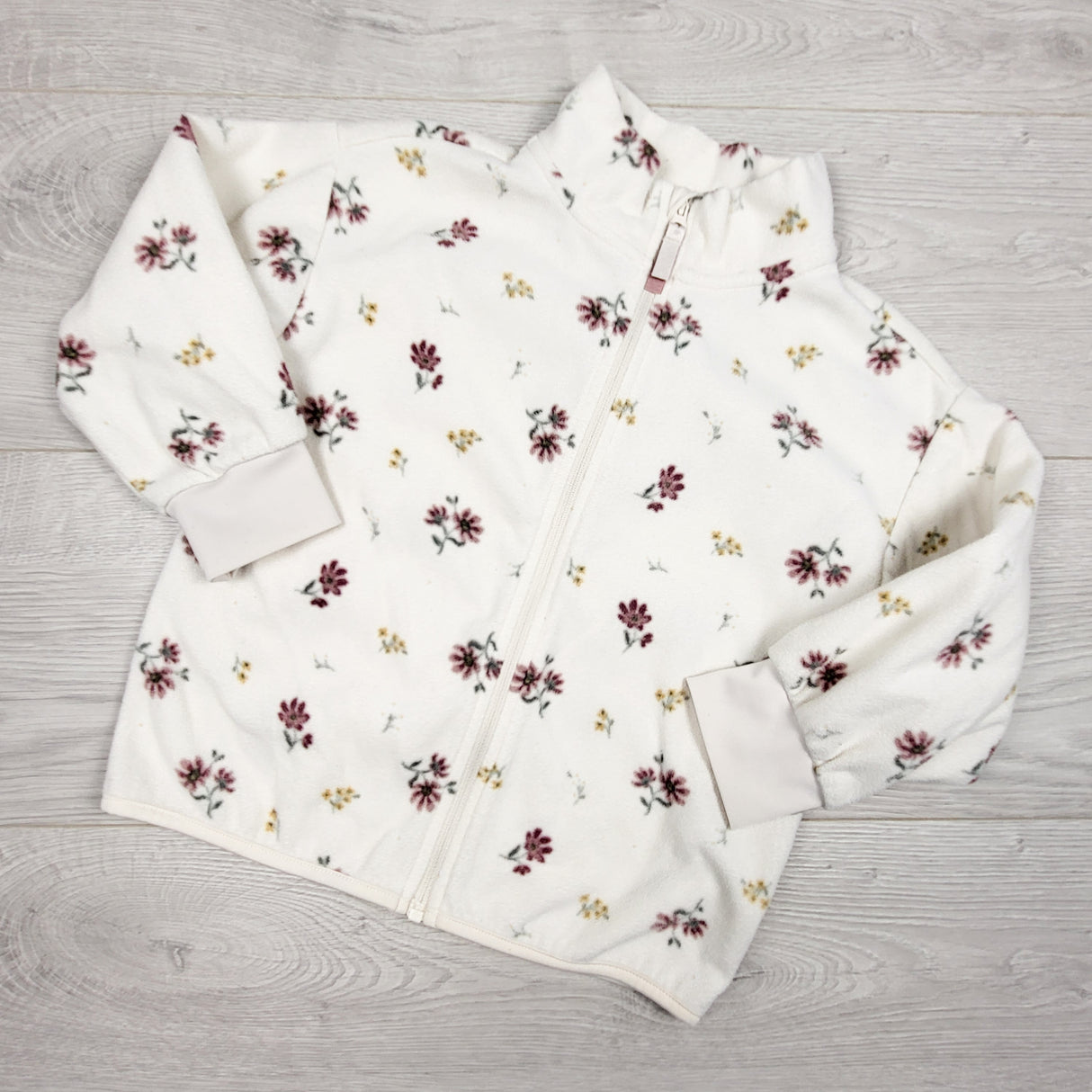 H and M white floral print zip up fleece jacket. Size 2-4T