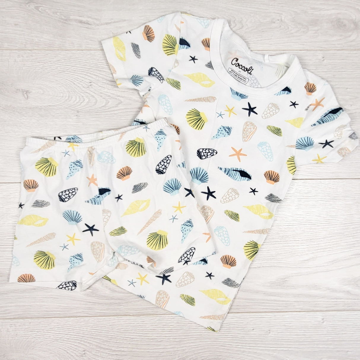 Coccoli white 2pc cotton/modal blend PJs with seashells. Size 3T