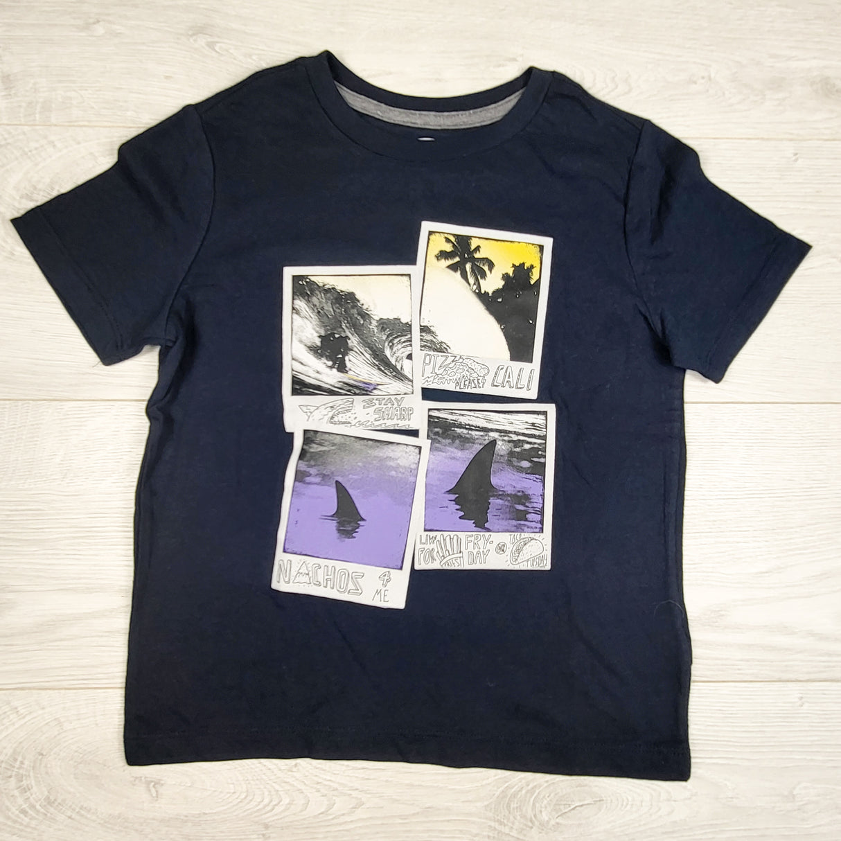 Old Navy navy t-shirt with polaroid shark fins. Size 6/7