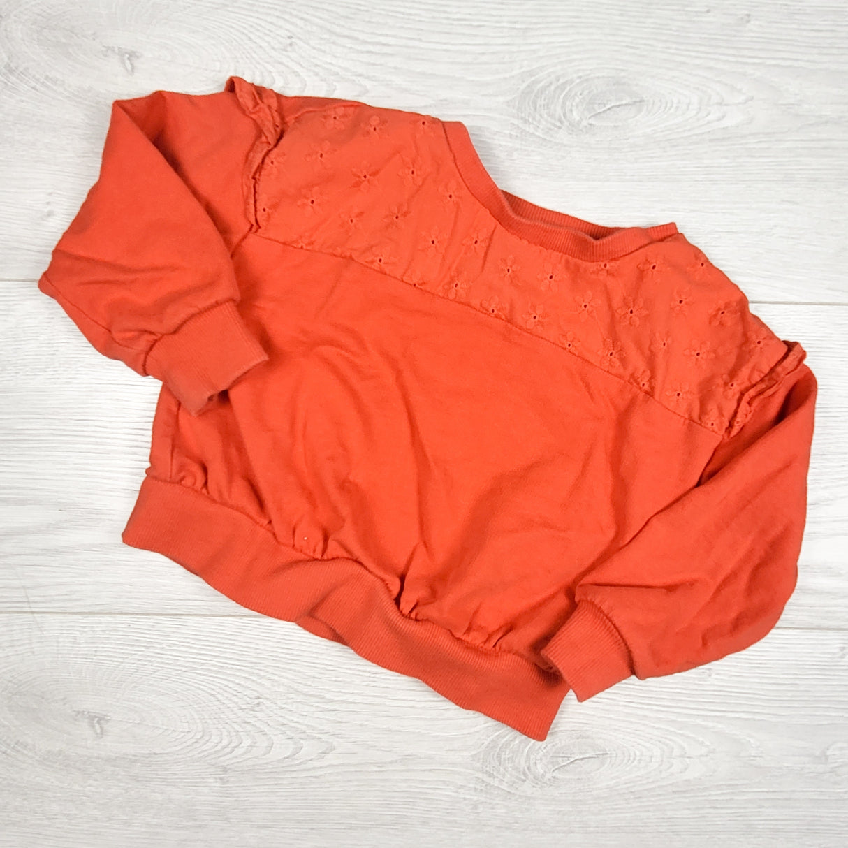 Carters reddish-orange sweatshirt with eyelet trim. Size 2T