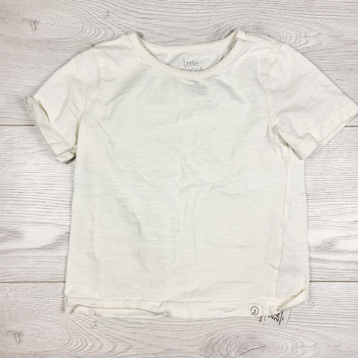 Little Planet cream coloured t-shirt. Size 2T