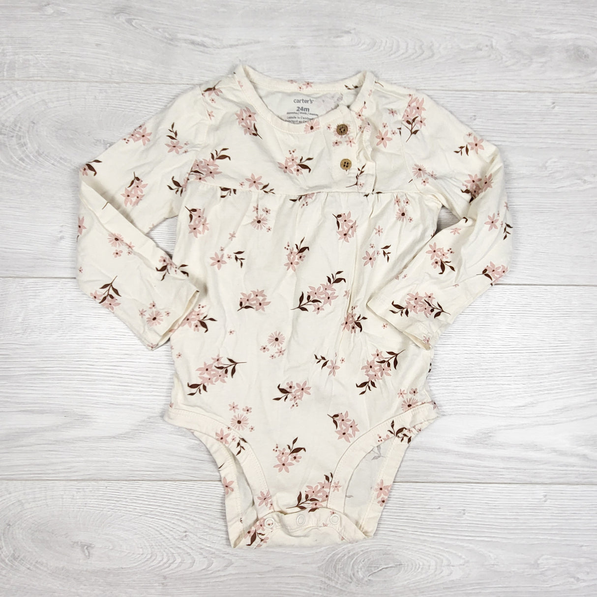 Carters cream coloured floral print bodysuit. Size 24 months