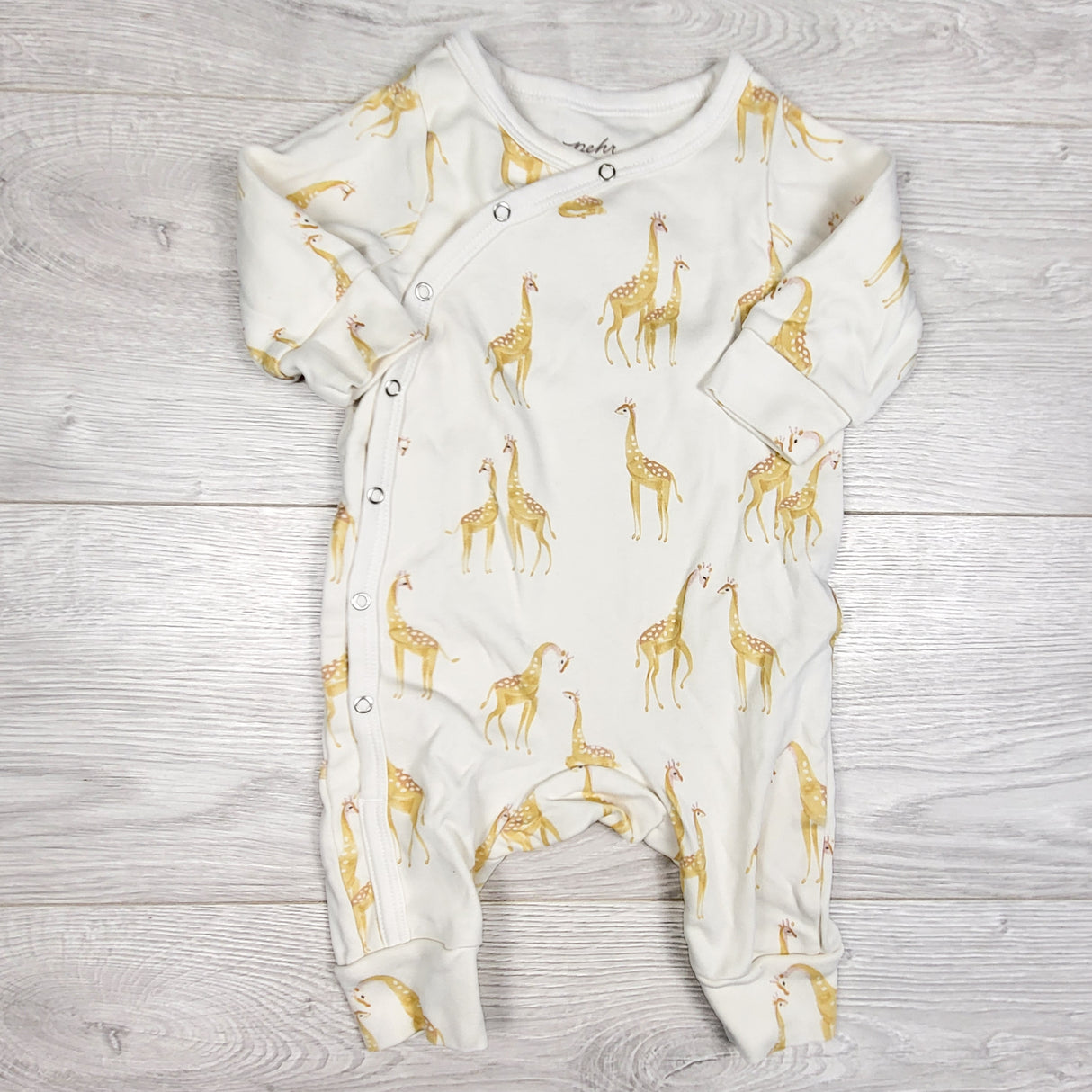 Pehr white organic cotton sleeper with giraffes.