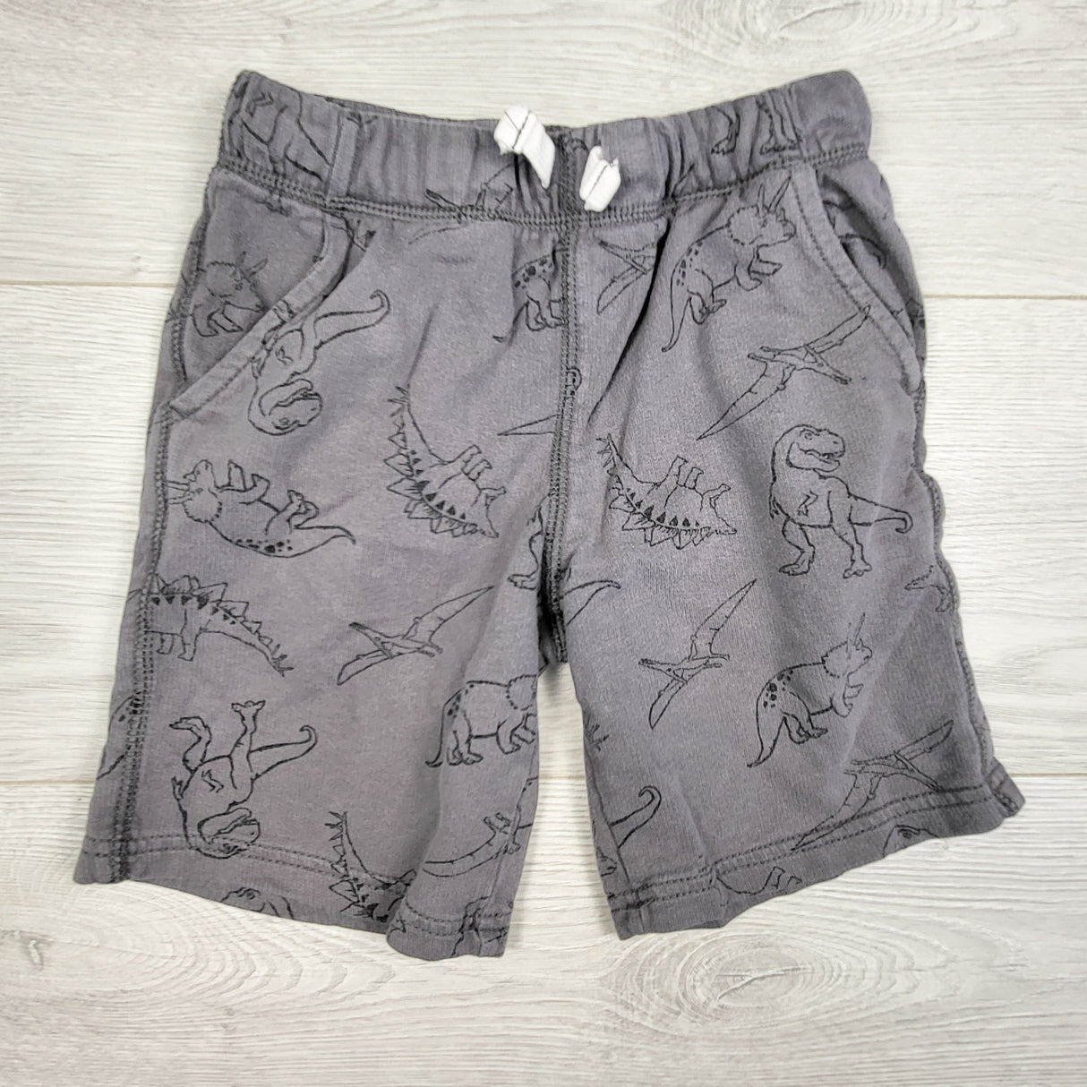 Carters grey drawstring shorts with dinosaurs. Size 6