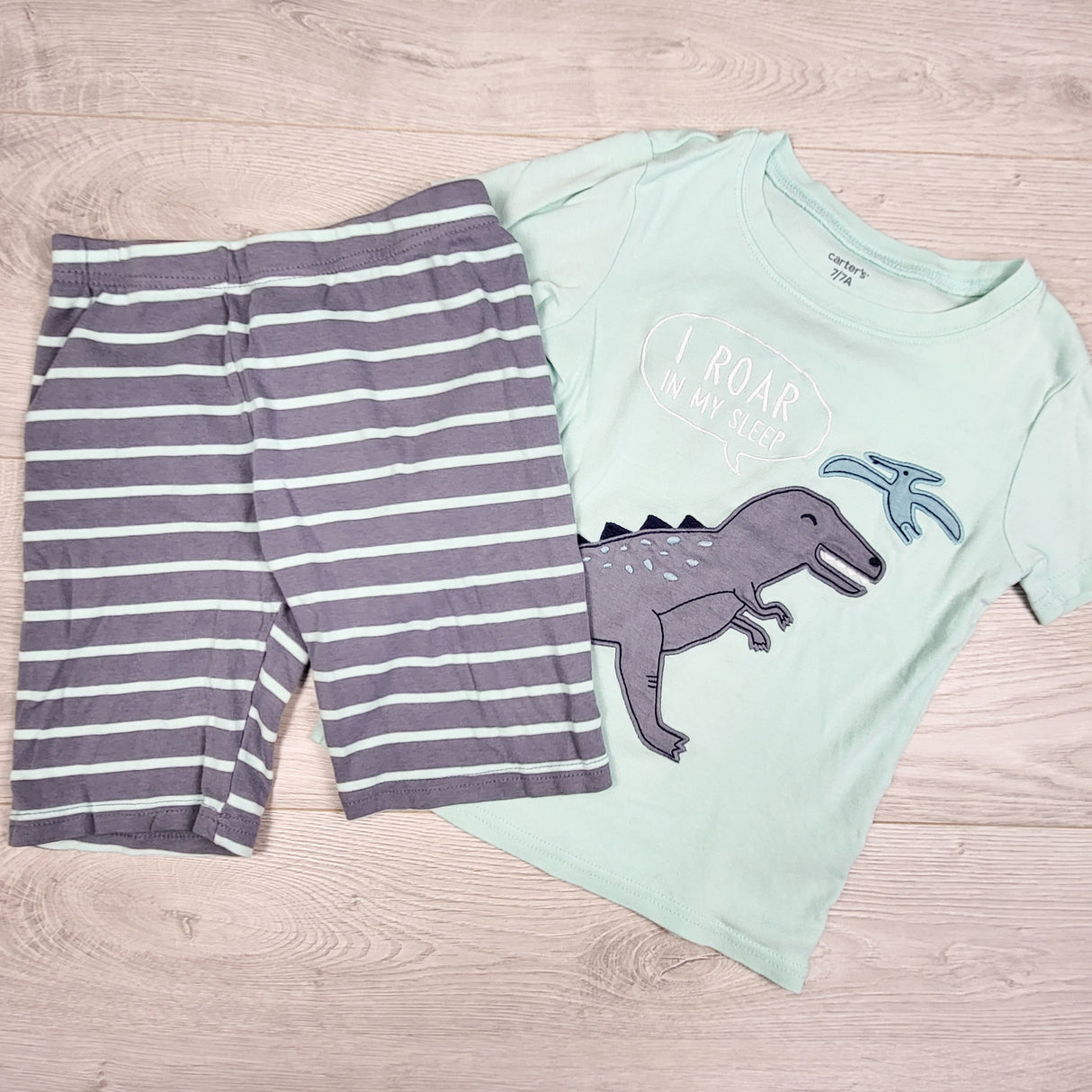 Carters grey and turquoise 2pc PJs with dinosaur. Size 7