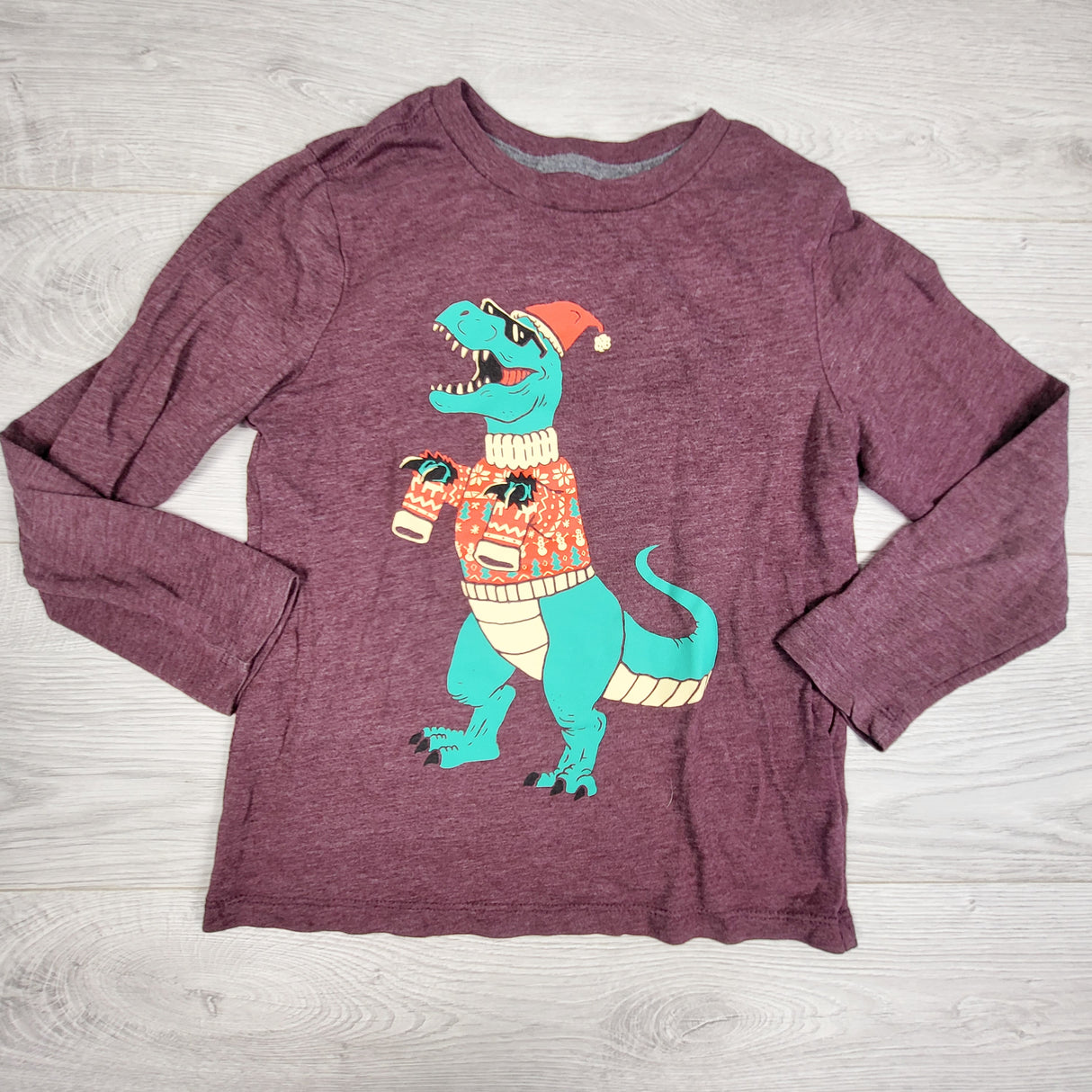 Old Navy plum coloured long sleeve top with dinosaur. Size 6/7