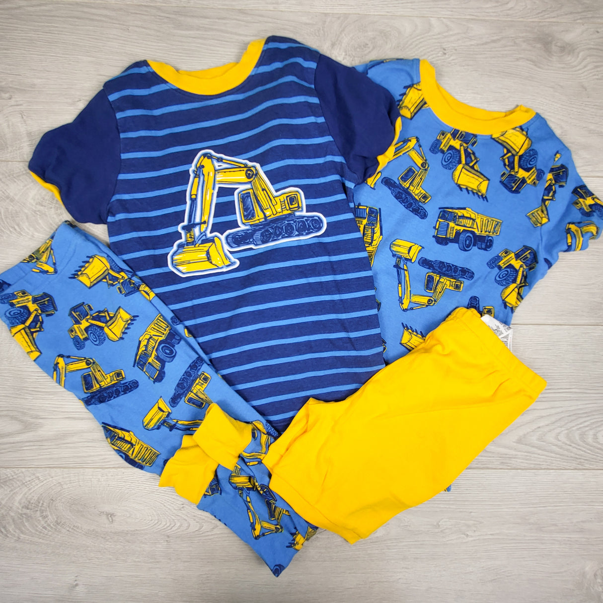 Kirkland blue 4pc PJs set with diggers. Size 7
