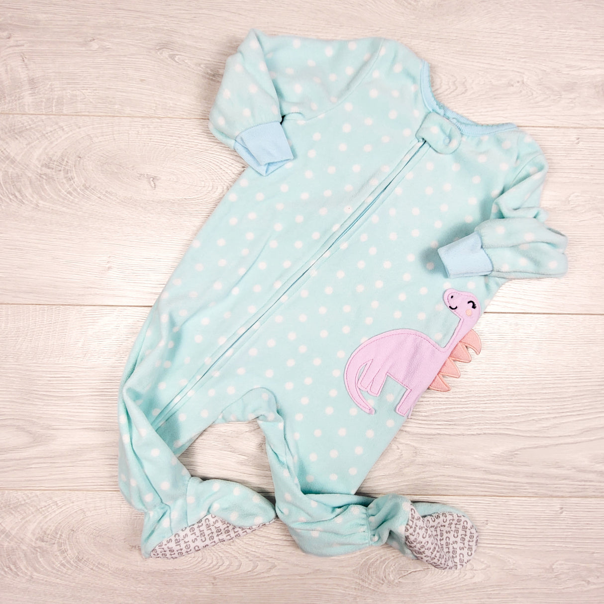Carters purple polka dot zippered fleece sleeper with dinosaur. Size 9 months