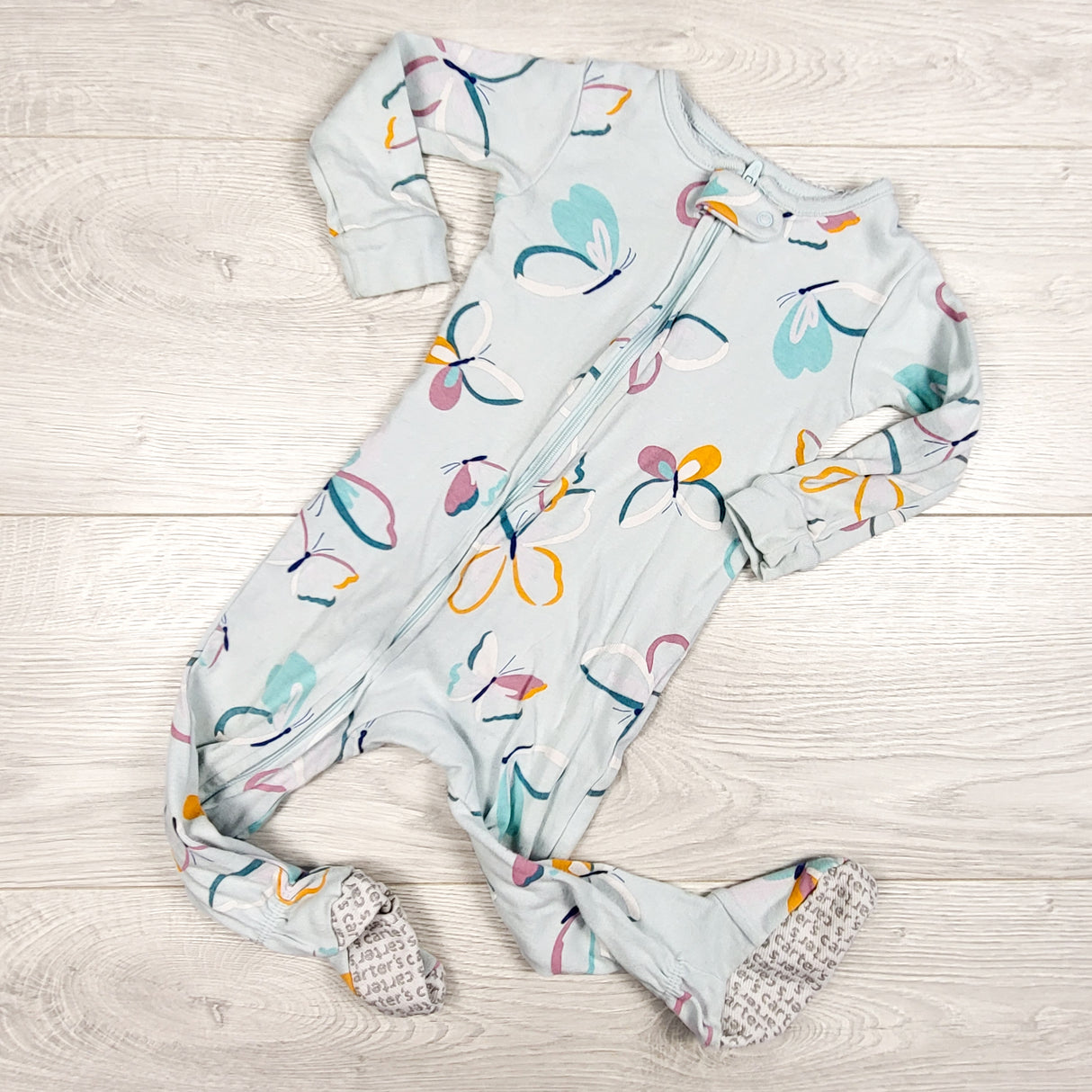 Carters blue zippered cotton sleeper with butterflies. Size 12 months