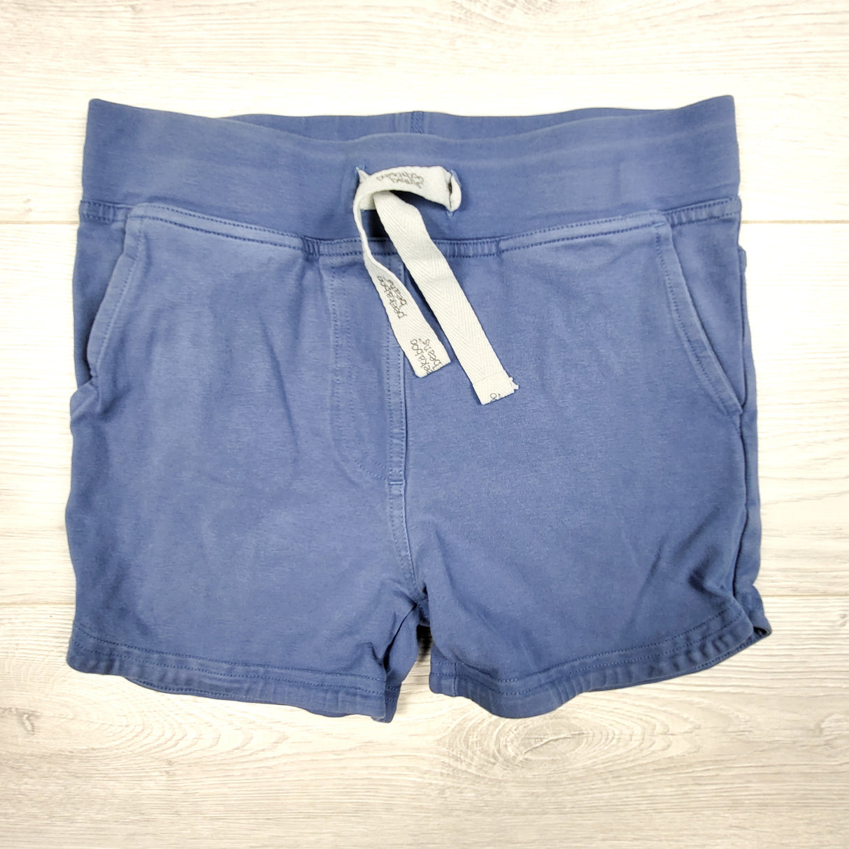 Peekaboo Beans blue drawstring shorts. Size 8