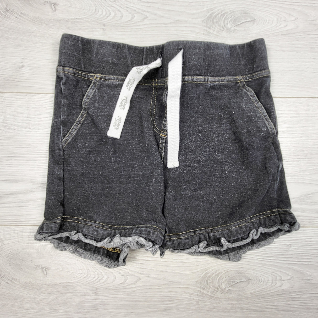 Peekaboo Beans grey denim ruffle shorts. Size 6
