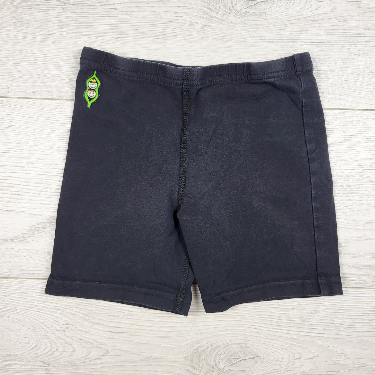 Peekaboo Beans black bike shorts. Size 7