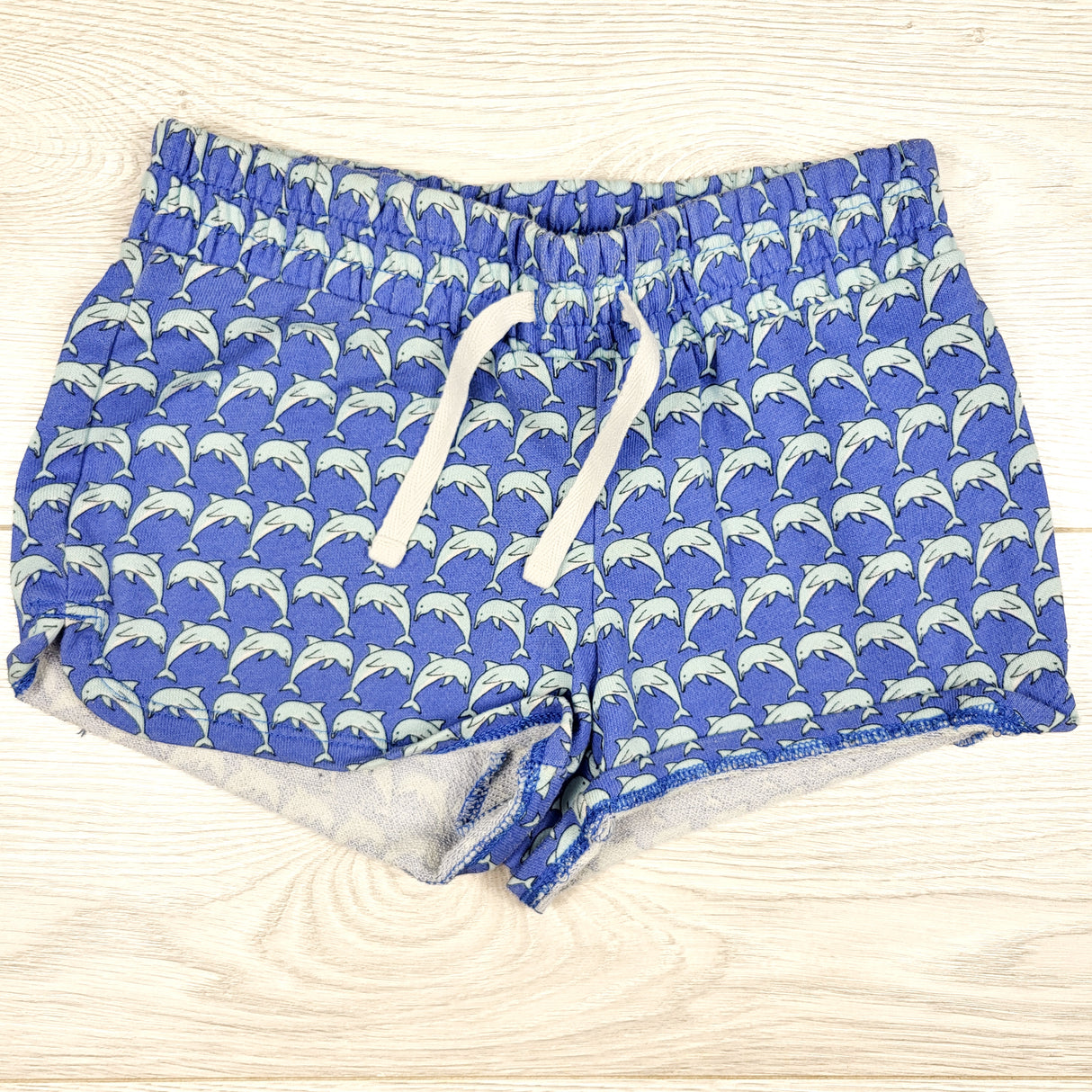 Gap blue drawstring shorts with dolphins. Size 6/7
