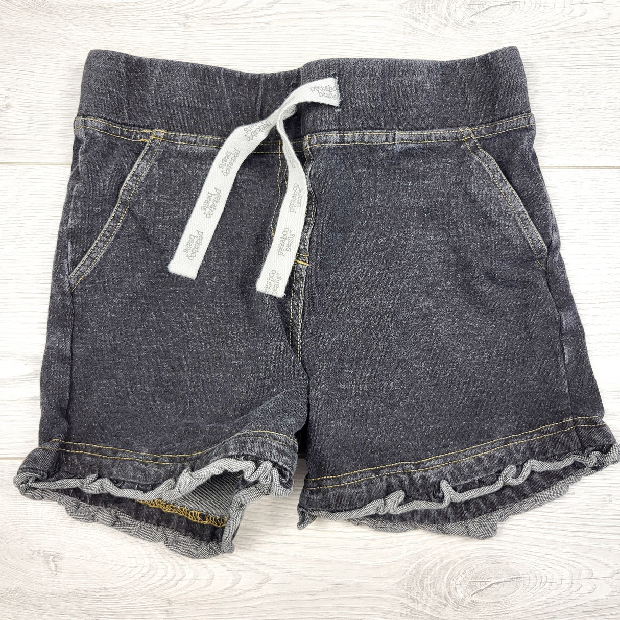 Peekaboo Beans grey denim ruffle drawstring shorts. Size 8