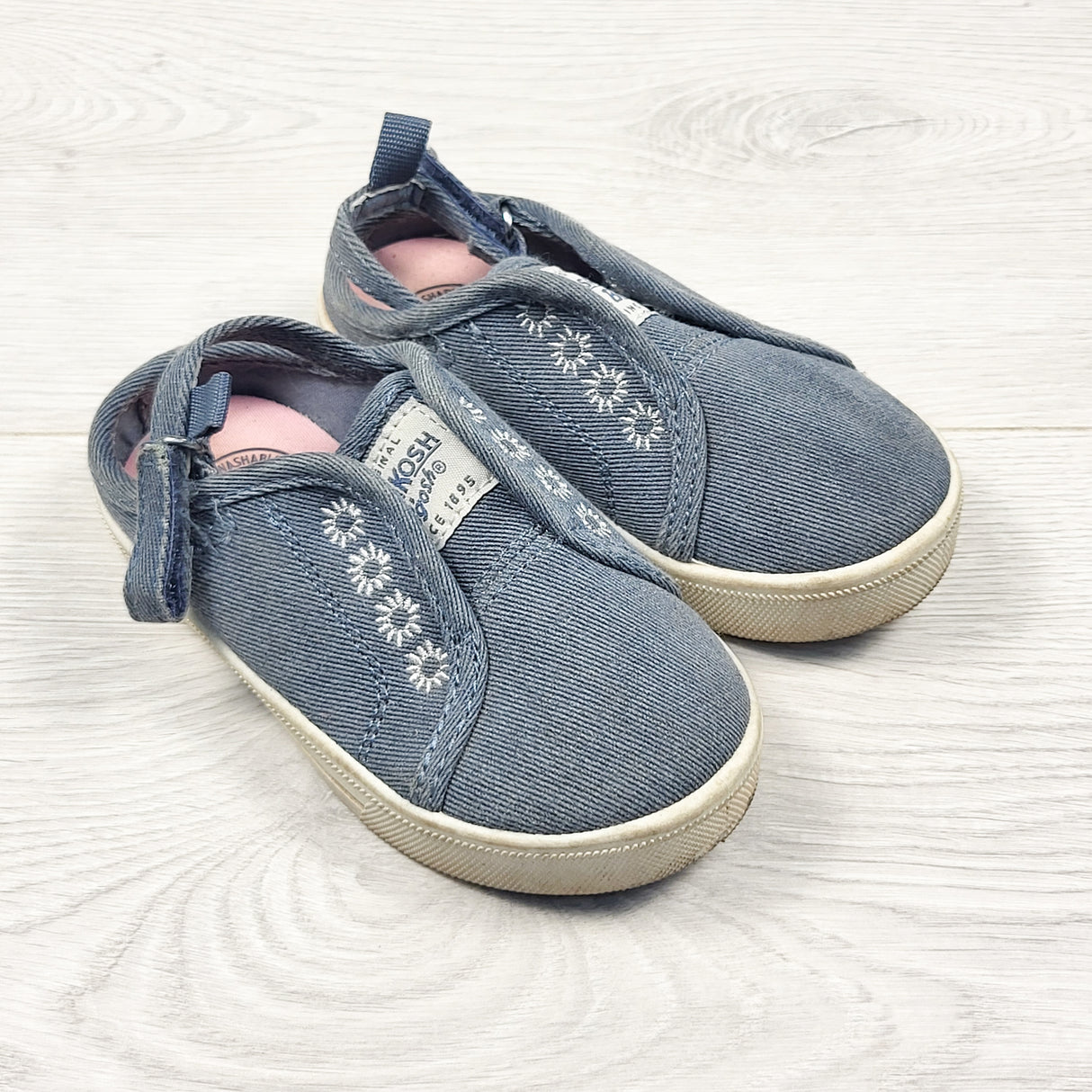 Oshkosh denim look slip-on shoes with open back. Size 6