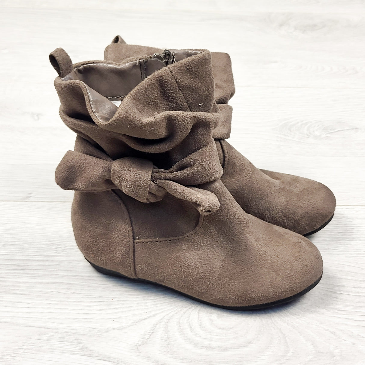Faux suede slouchy boots with bow. Size 8