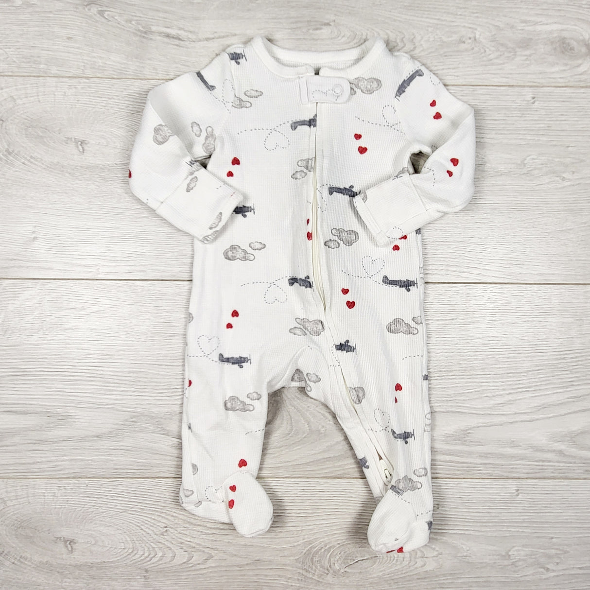 Child of Mine white zippered waffle knit sleeper with airplanes. Size 0-3 months