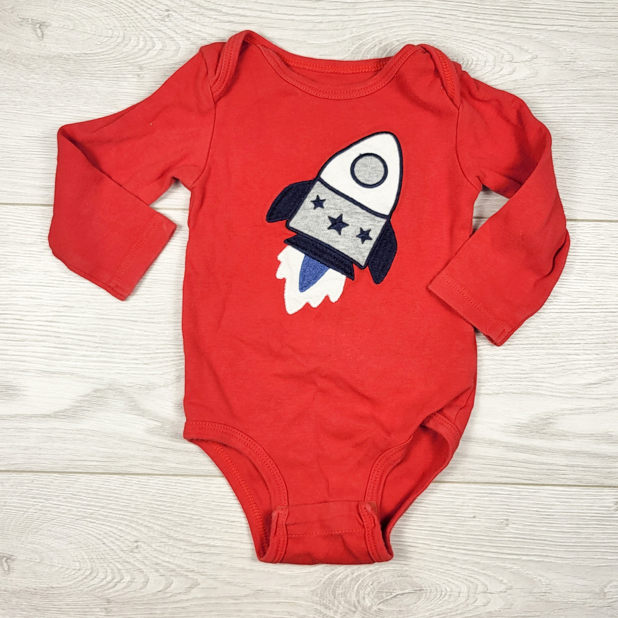 Pekkle red bodysuit with rocket. Size 9 months