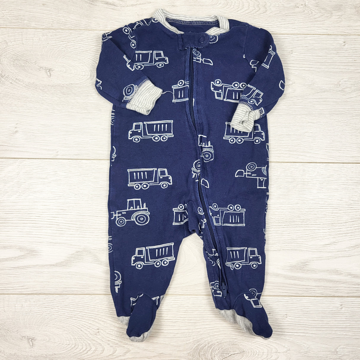 Carters navy zippered sleeper with construction theme. Size 3 months