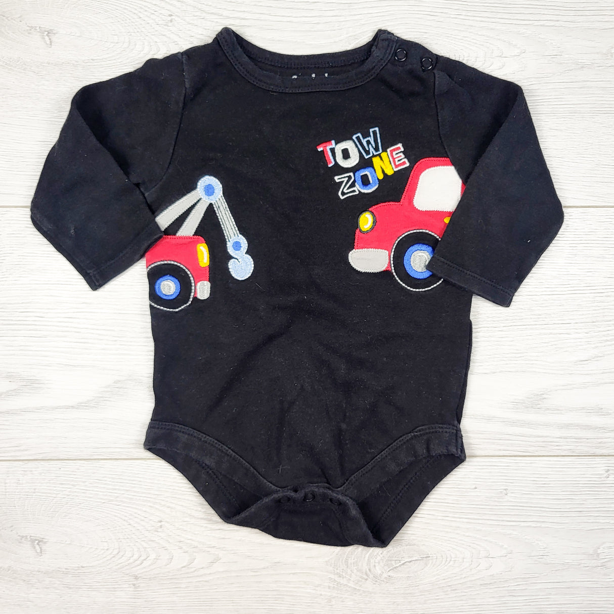 Garanimals black bodysuit with tow truck. Size 6-9 months