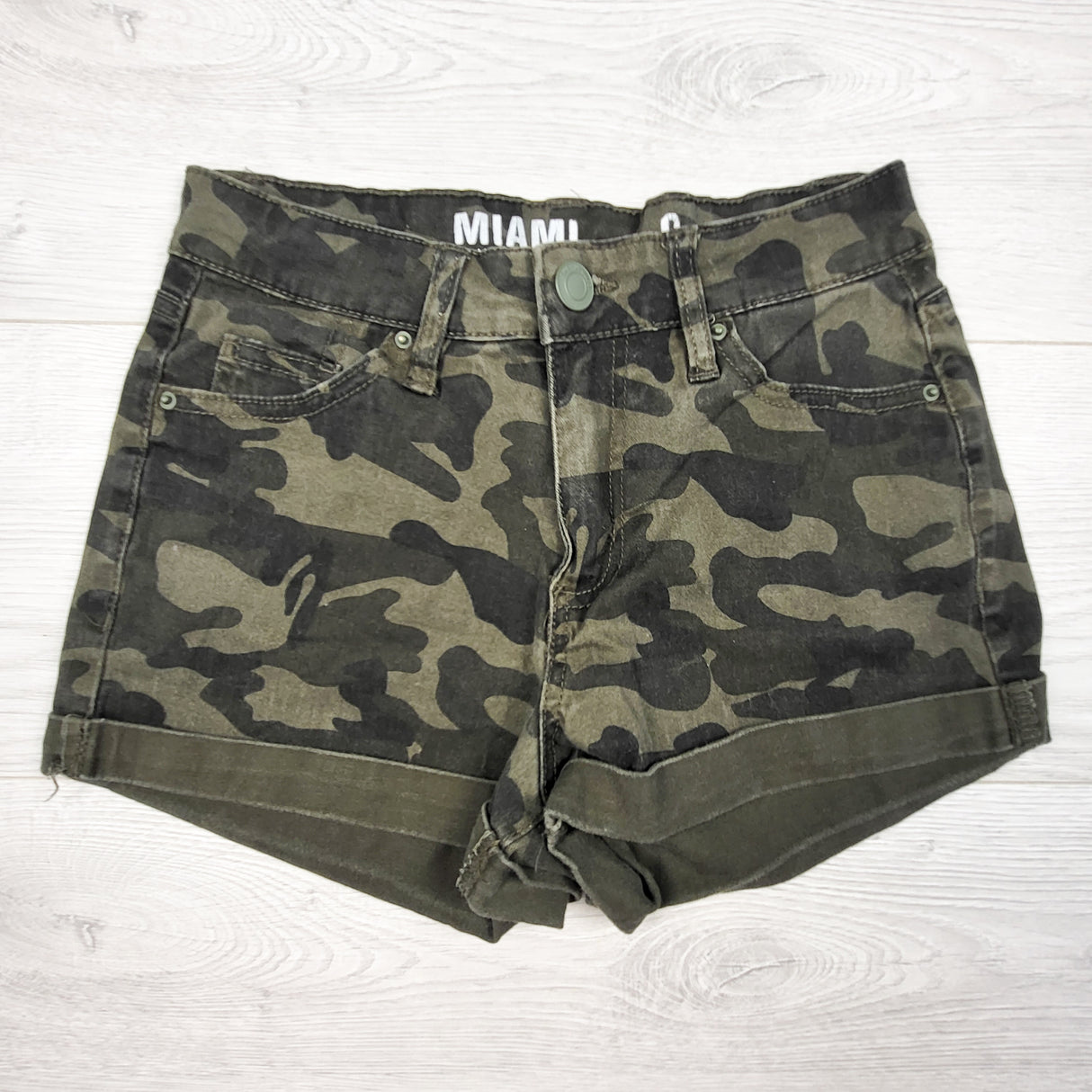 Green camouflage high rise jean shorts. Adult size 0