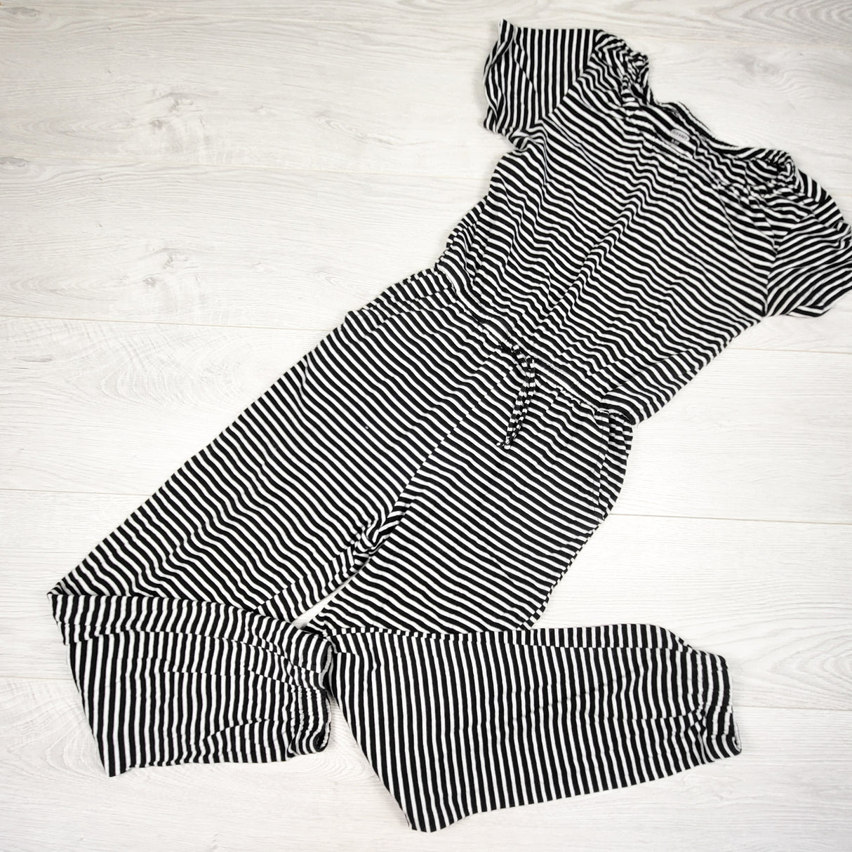 Old Navy black striped romper. Size 14