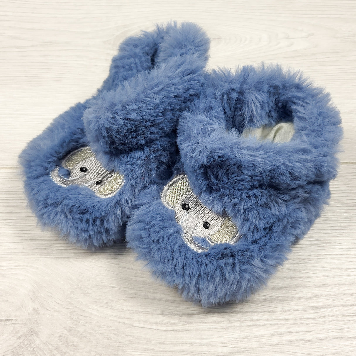 Blue fuzzy slippers with elephants. Approx 3-6 months