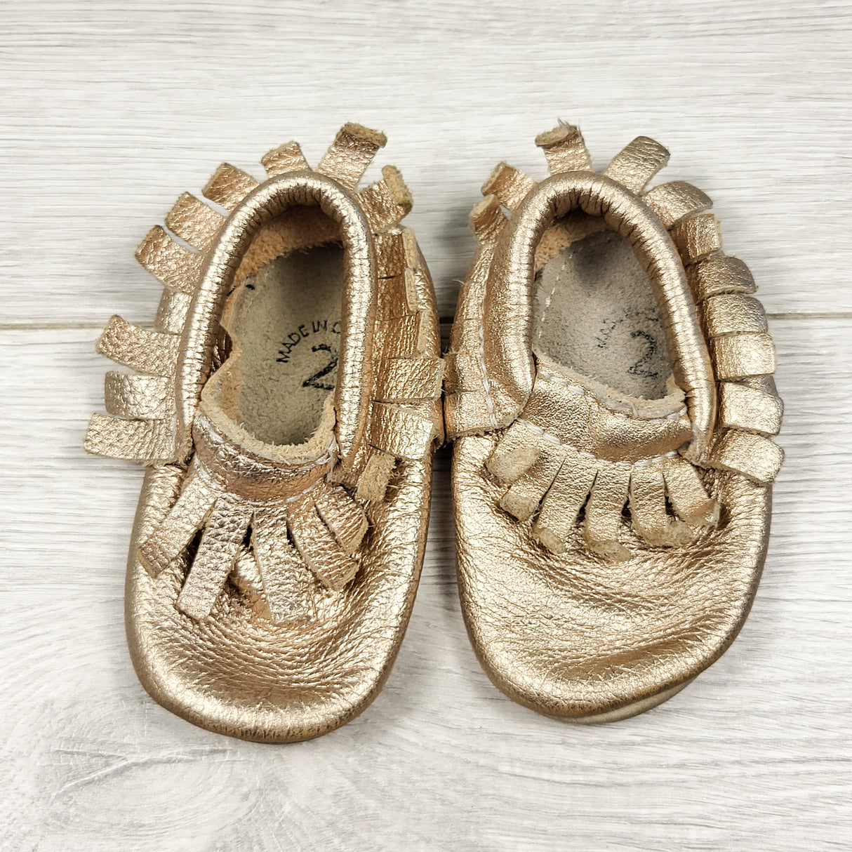 Minimoc gold leather soft soled shoes. Size 2 (infant)