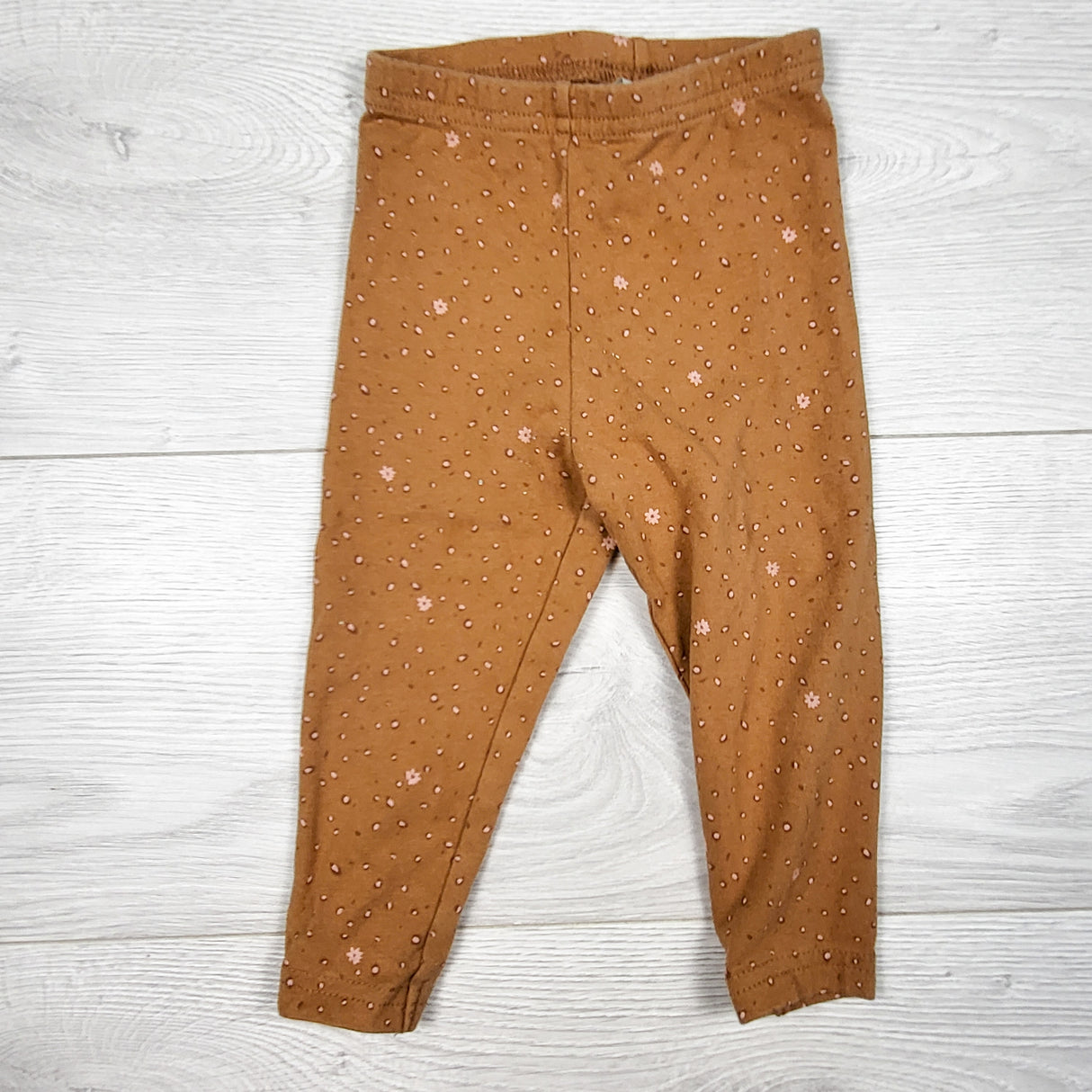 Carters tan patterned leggings. Size 12 months